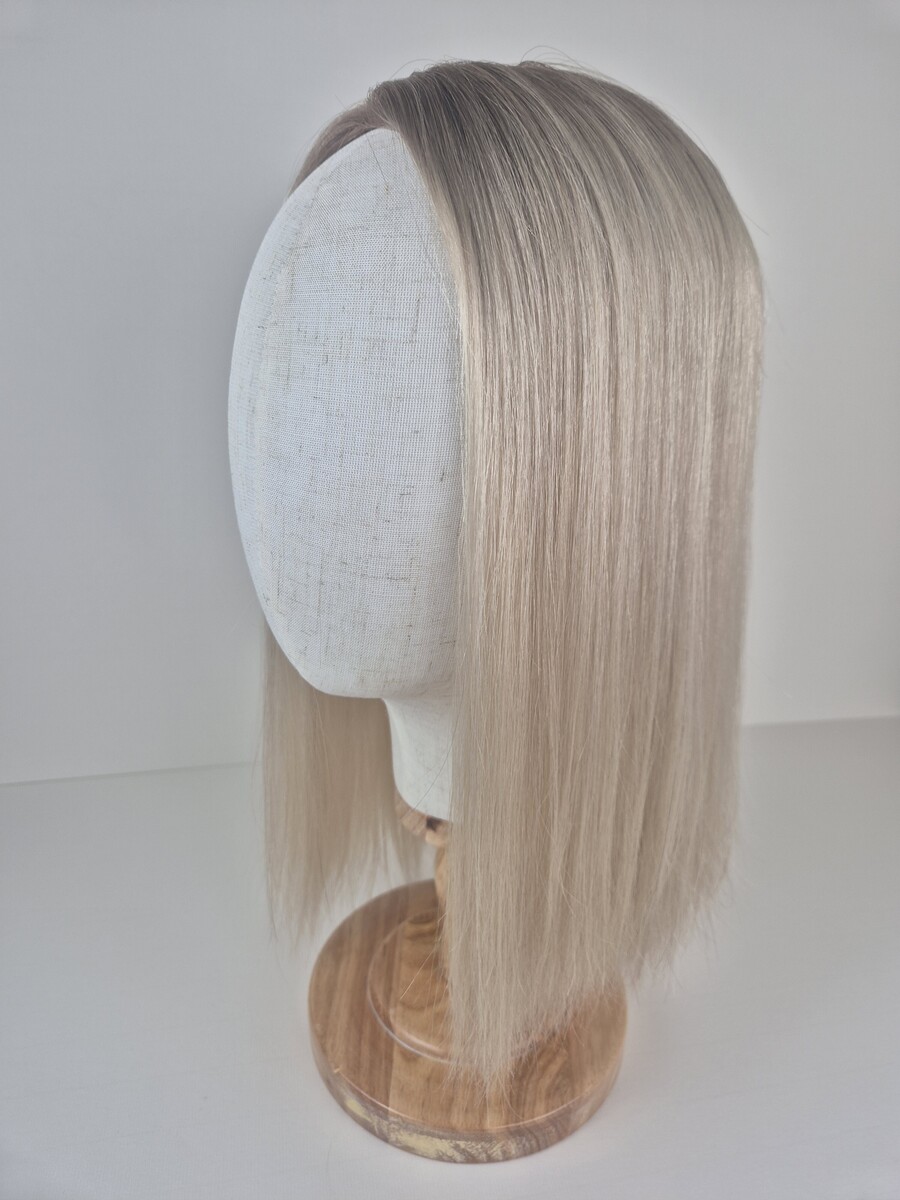 Claire Ribbon Silk l topper 16 inches in length light blonde with a beige root styled straight displayed on a Mannequin