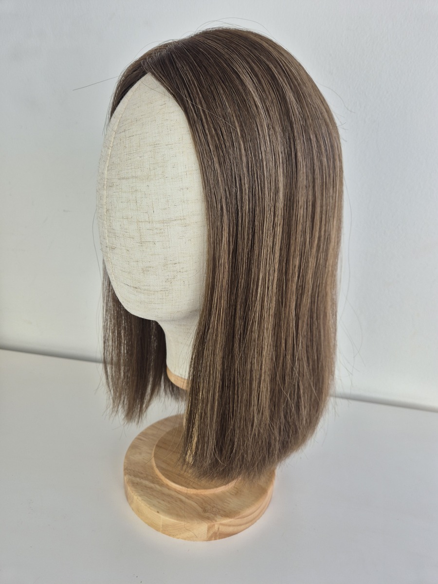 Maya Hair Silk lite topper 14 inches in length light brunette with blonde highlights displayed on a Mannequin