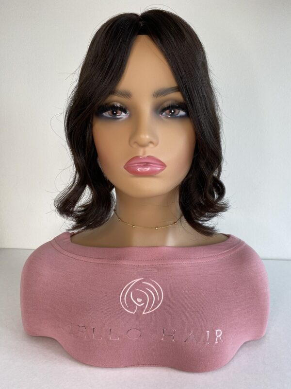 Kiara Silk base hair topper 12 inches in length displayed on a mannequin with a soft wave all one length