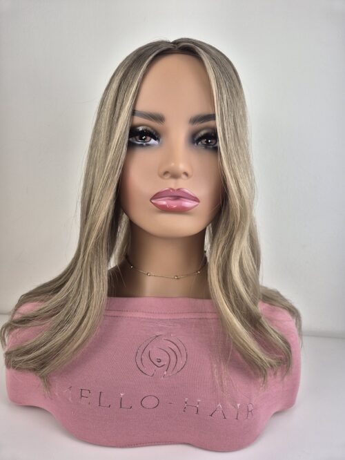 Florence hair topper 5by6 cap medium blonde with a natural root Displayed on a mannequin 16 inches long low density.