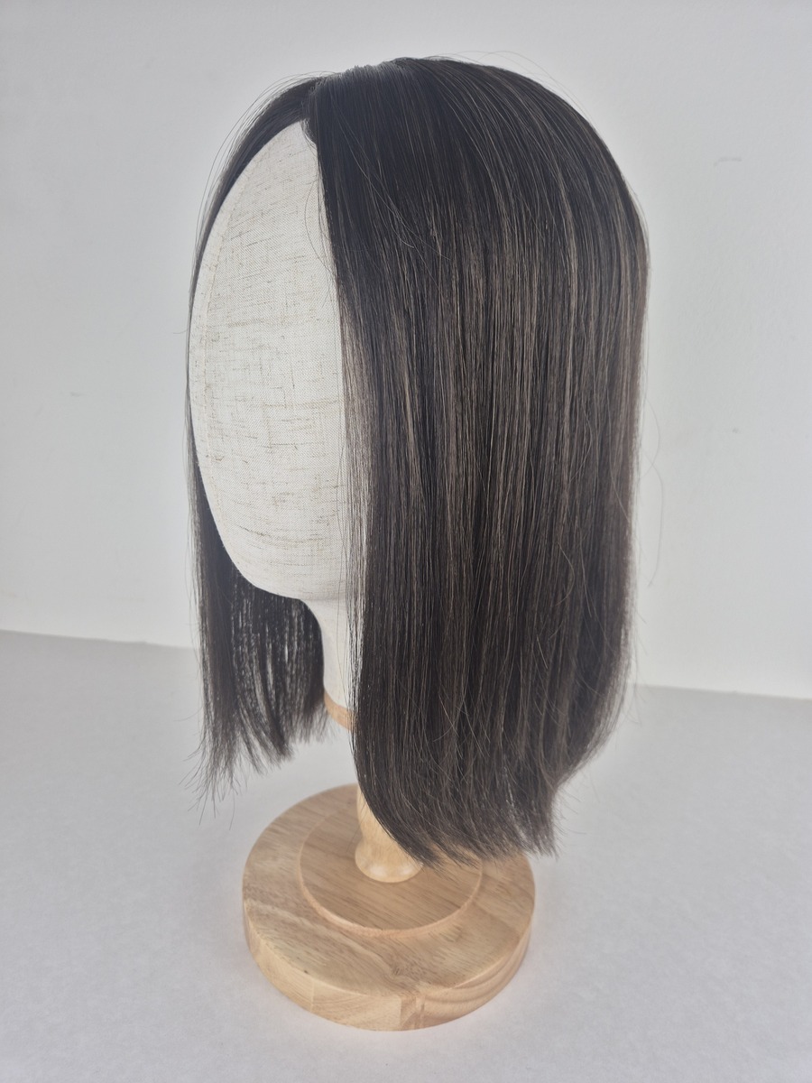 Amber Lace Topper Amber lace top hair topper 14 inches in length brunette with caramel highlights displayed on a mannequin