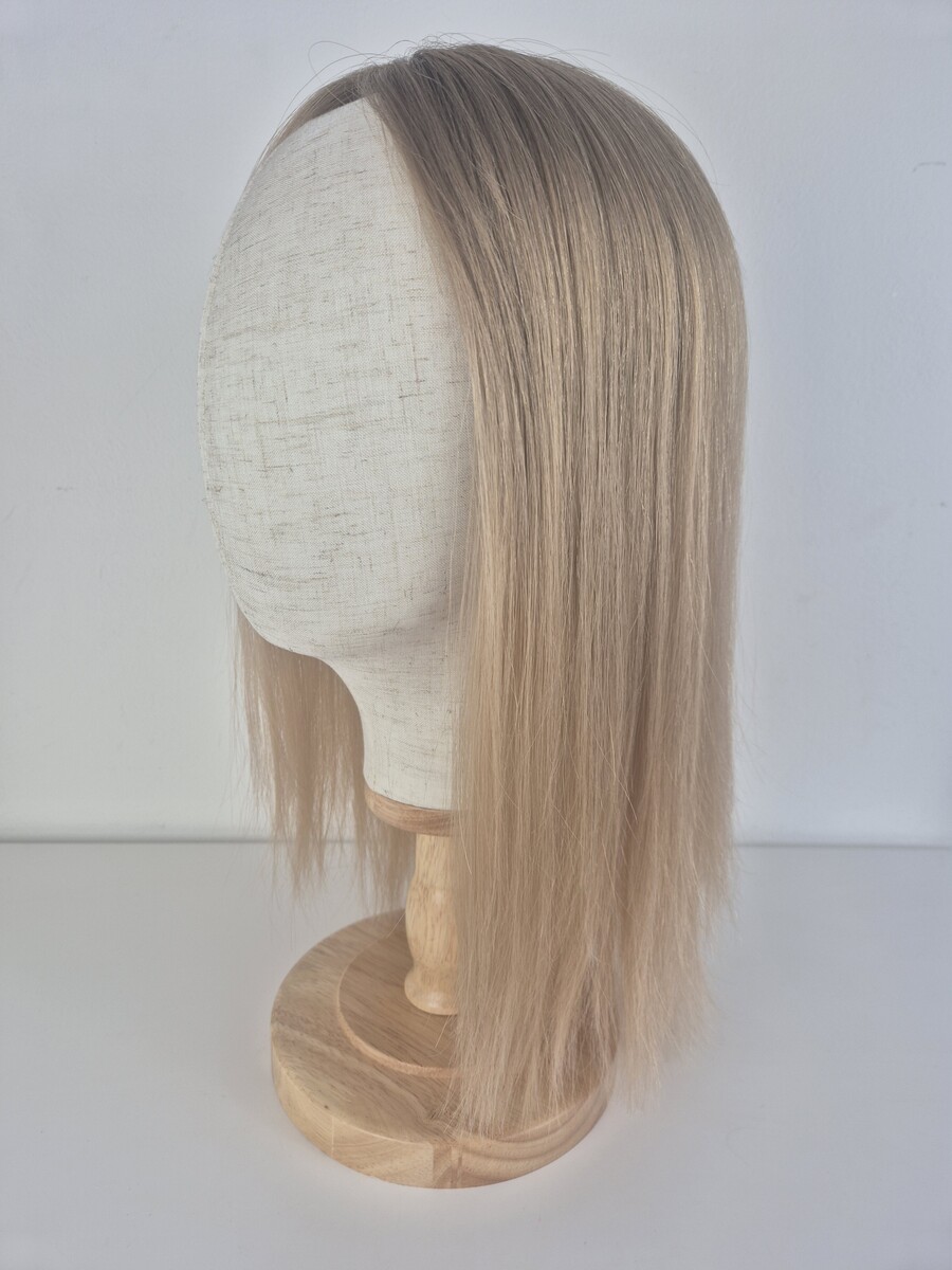 Chloe Lace Topper 16 inch hair topper styled straight medium blonde. Displayed on a mannequin