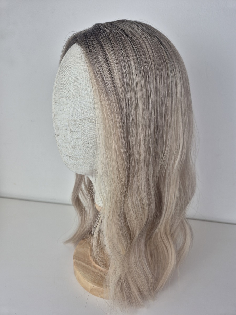 Juliet Lace Topper 18 inches in length cool blonde with a ash root displayed on a mannequin
