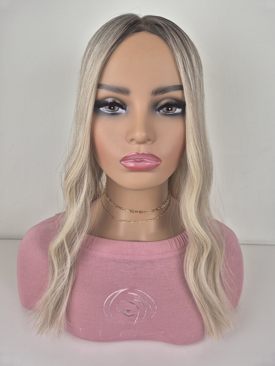 Juliet Lace Topper 18 inches in length cool blonde with a ash root displayed on a mannequin