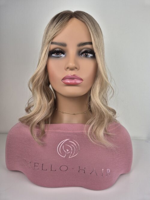 Lydia Hair Topper in medium blonde 16 inches in length with a soft natural root displayed on a mannequin