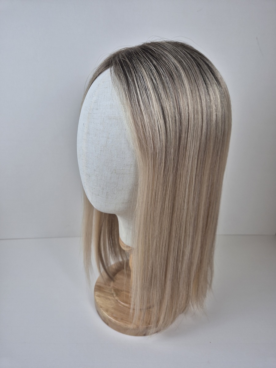 Stephanie Lace Topper 16 inch light neutral blonde ash dimension and root. Displayed on a mannequin