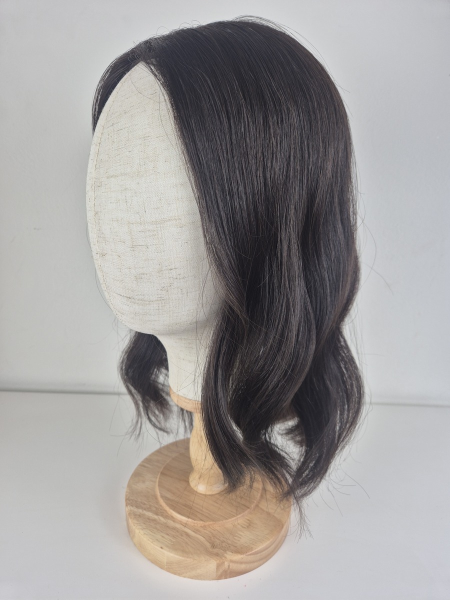 Cara Lace Topper darkest brown 16 inches styled in a wave and displayed on a mannequin