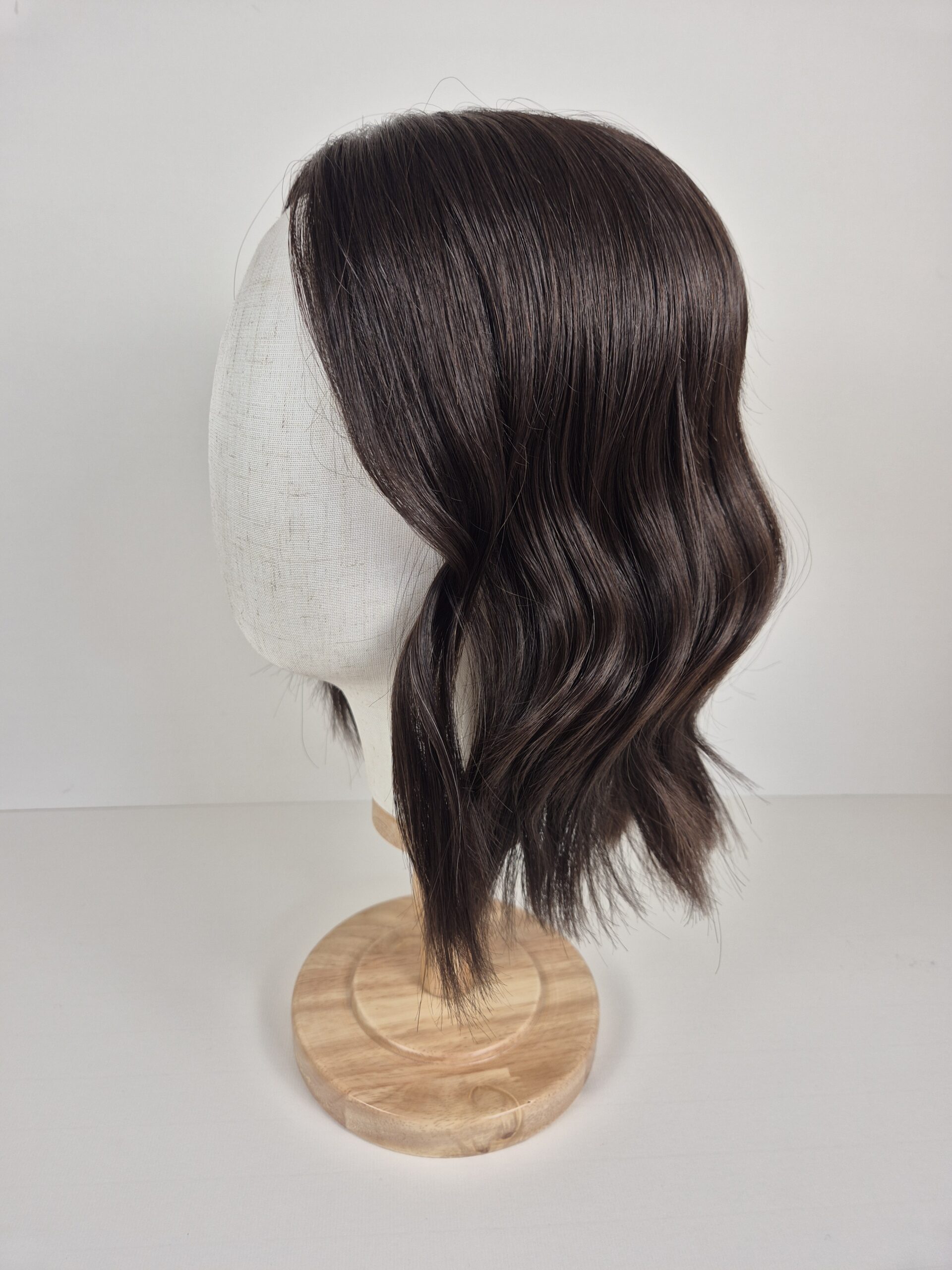Cara Lace Topper espresso brown deep brunette 14 inches styled in a wave and displayed on a mannequin