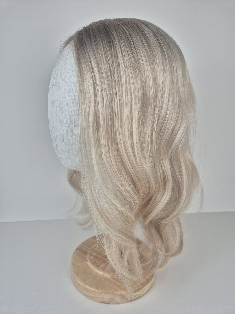 Claire Lace Topper 18-inch length light blonde with a beige root. Displayed on a Mannequin