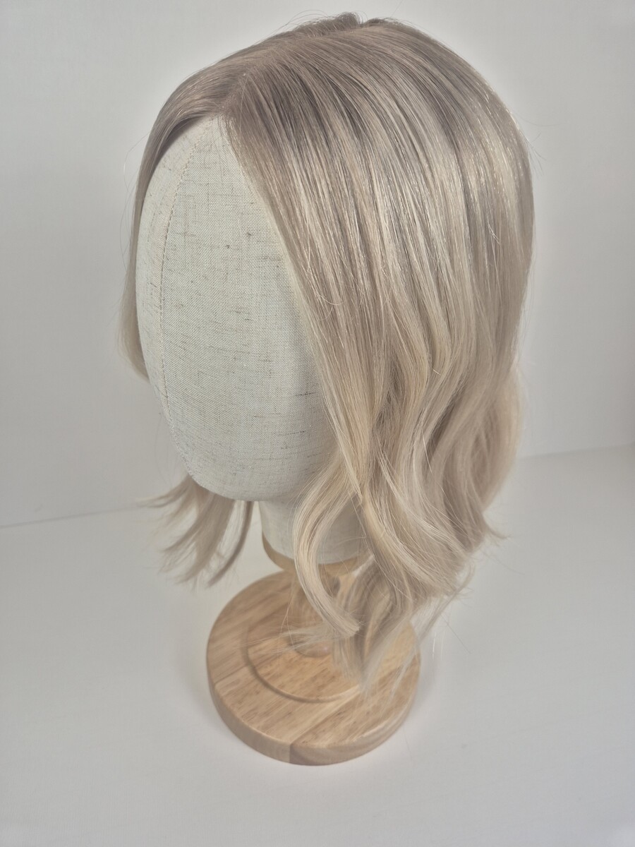 Claire Lace Topper 14-inch length light blonde with a beige root. Displayed on a Mannequin
