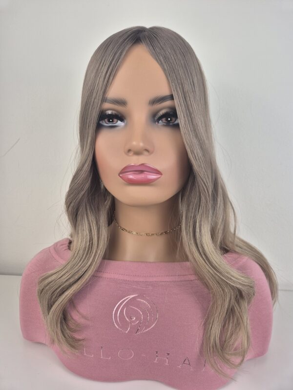 Crystal silk top hair topper 18 inches in length ashy blonde balayage displayed on a mannequin