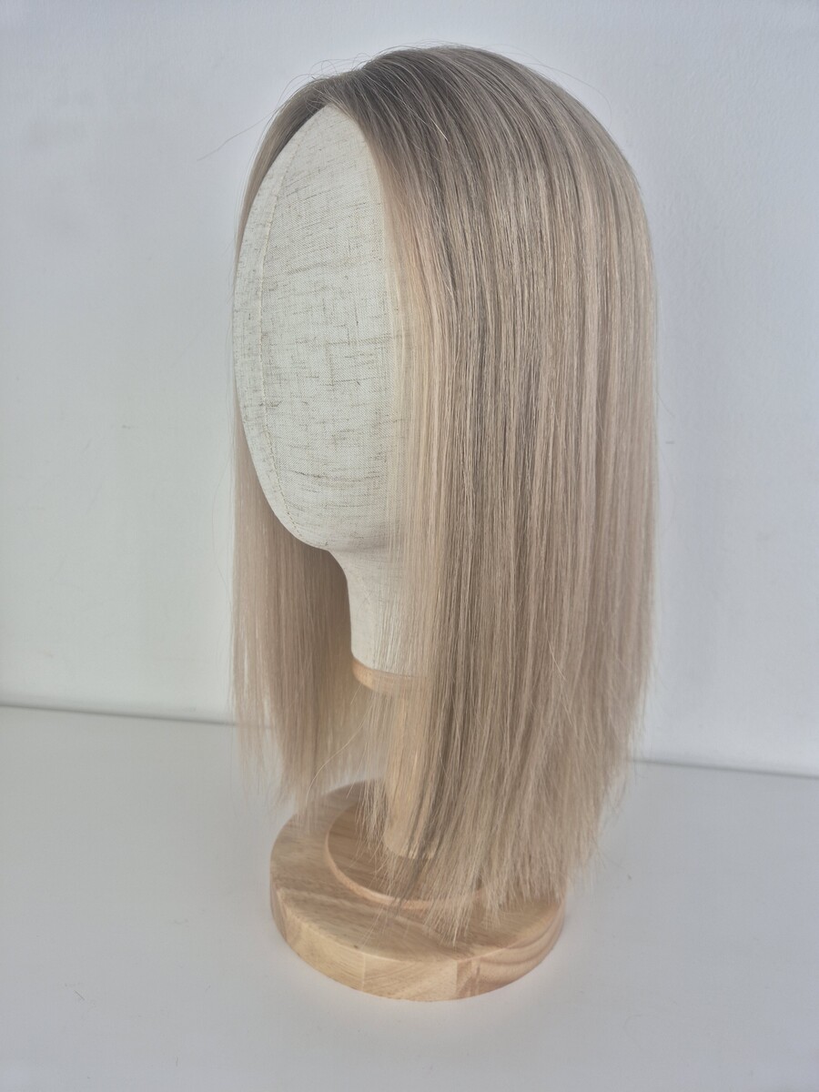 Kelly Lace Topper 16 inch creamy blonde styled straight displayed on a mannequin