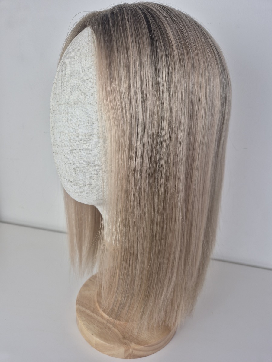Kelly Lace Topper 16 inch creamy blonde styled straight displayed on a mannequin