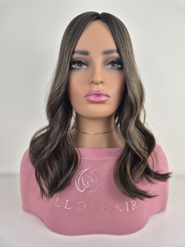 Naomi Silk top hair topper 16 inches in length darker brown with golden highlight displayed on a Mannequin