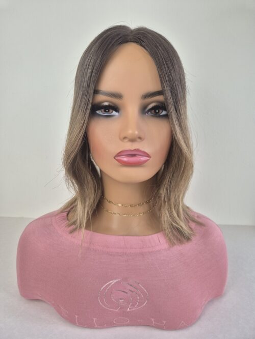 Lydia Lace Topper 13 inches in length stretch darker root with blonde ends. displayed on a mannequin