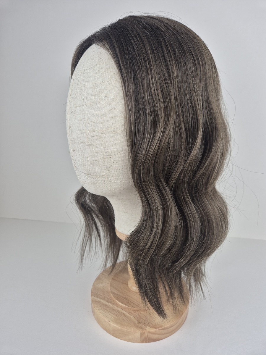 Vivienne Lace Topper 16 inches in length medium brown with fine ash beige highlights. Displayed on a mannequin styled with a wave