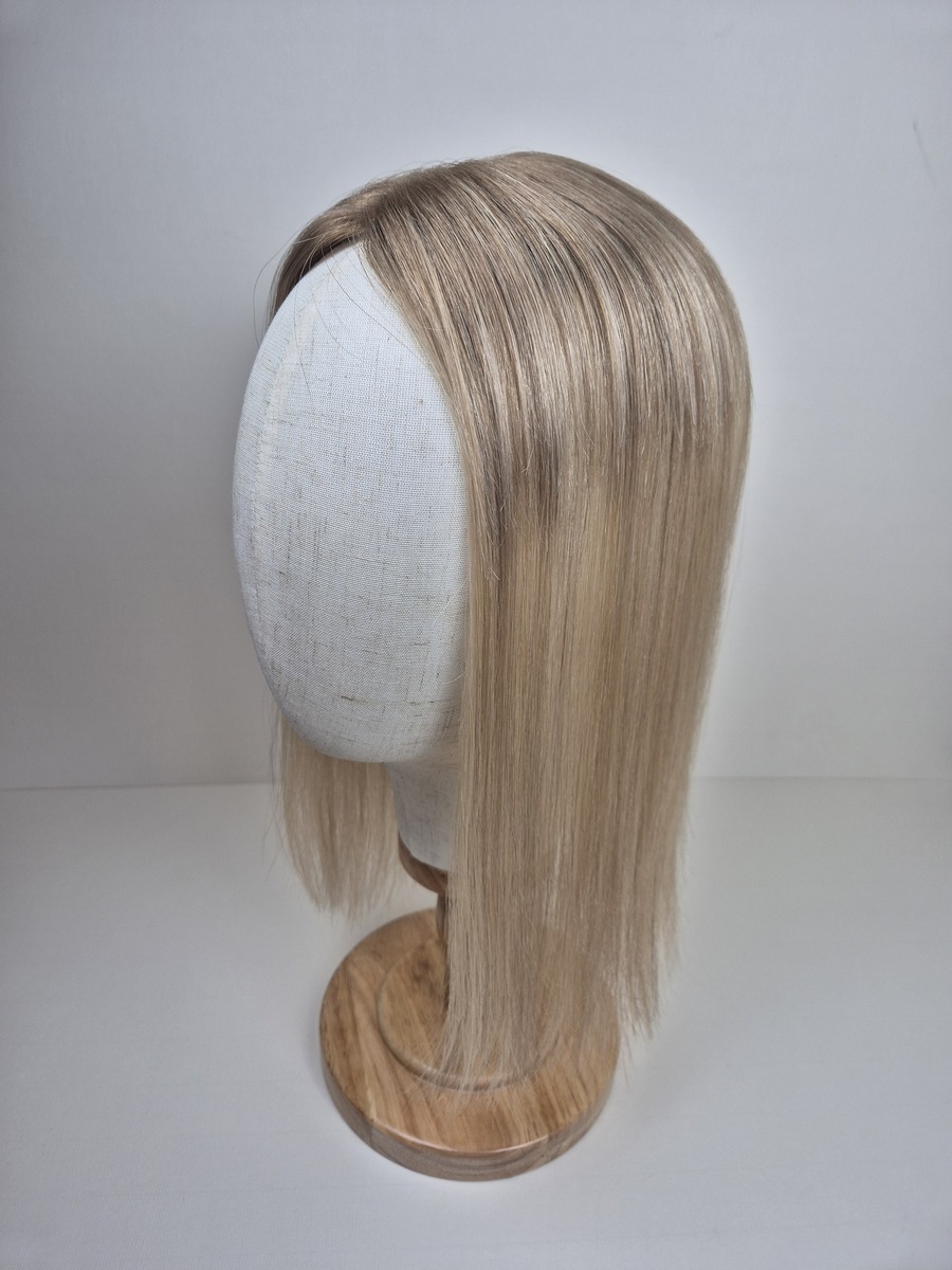 Clara Tiny Topper 16 inch length blonde with a subtle root styled straight displayed on a mannequin