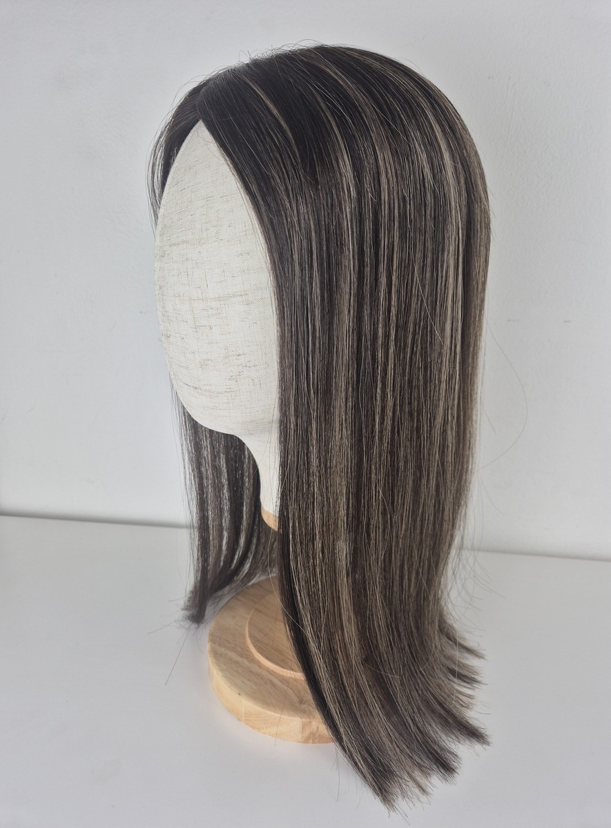 Tiny Topper Rihanna low density topper 18 inches in length medium brown with soft ash dimension styled straight and displayed on a mannequin.