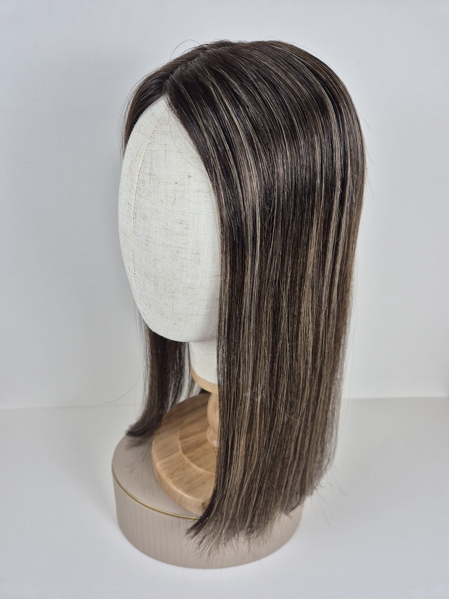 Rihanna Tiny Topper 18 inches in length medium brown with cool blonde highlights styled straight displayed on a mannequin
