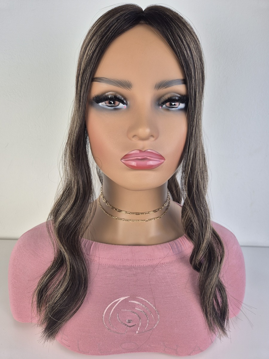 Tiny Topper Rihanna low density topper 18 inches in length dark brunette with highlights. curled and displayed on a mannequin.