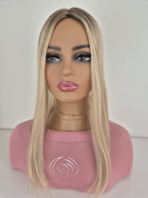 Tiny Topper Clara low-density hair topper 16-inch length styled straight neutral blonde with a root smudge displayed on a mannequin