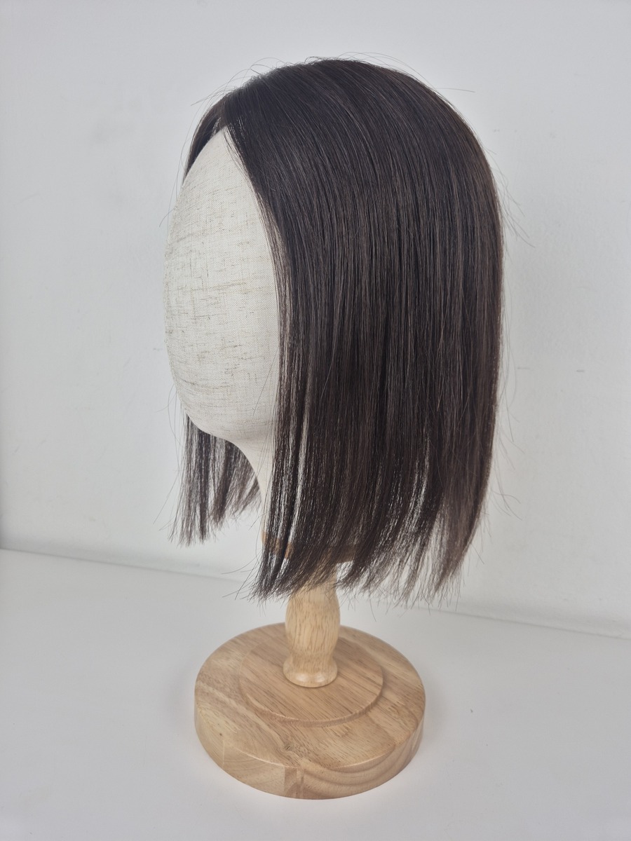 Tiny Topper Cara low density hair topper 12-inch length in espresso brown deep brunette. styled straight. Displayed on a mannequin