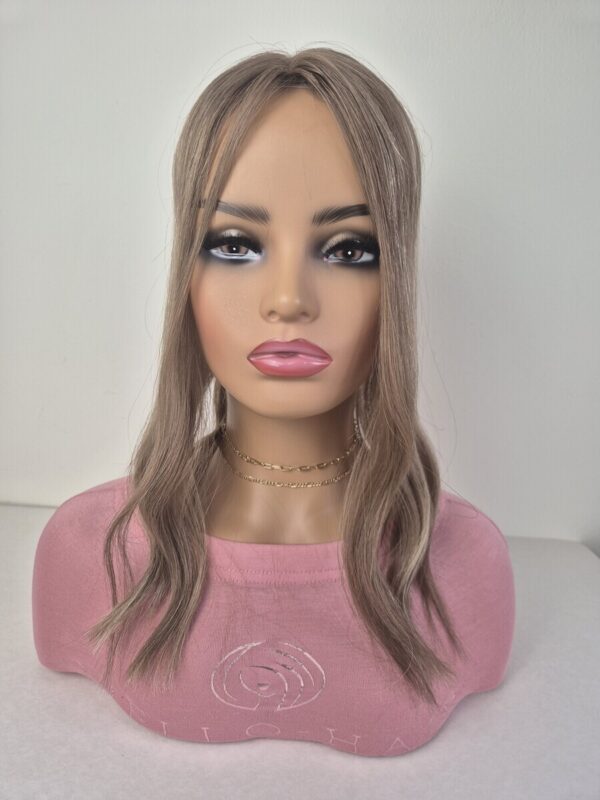 Tiny Topper Klara low-density hair topper 16-inch length in light brown with added highlights Displayed on a mannequin