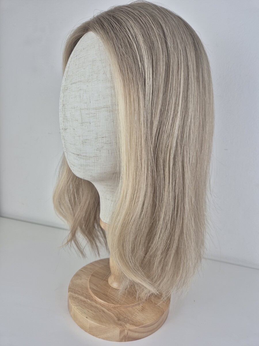 Samantha Lace Topper 16 inches medium blonde with subtle root fade displayed on a mannequin with soft waves