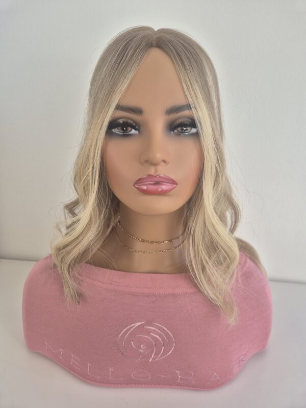 Samantha Lace Topper 16 inches medium blonde with subtle root fade displayed on a mannequin with soft waves