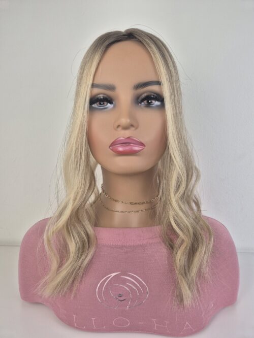 Tiny Topper Belle low-density hair topper 16 inch length neutral to warm blonde with a added root displayed on a mannequin