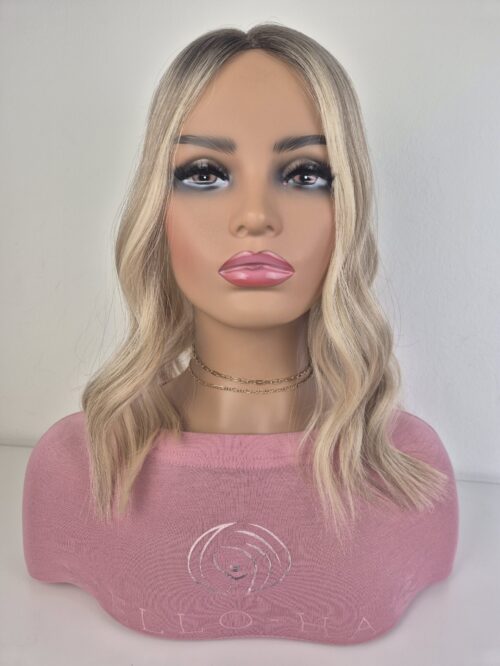 Serena lace topper 16 inch length cool blonde with a natural ash root displayed on a mannequin