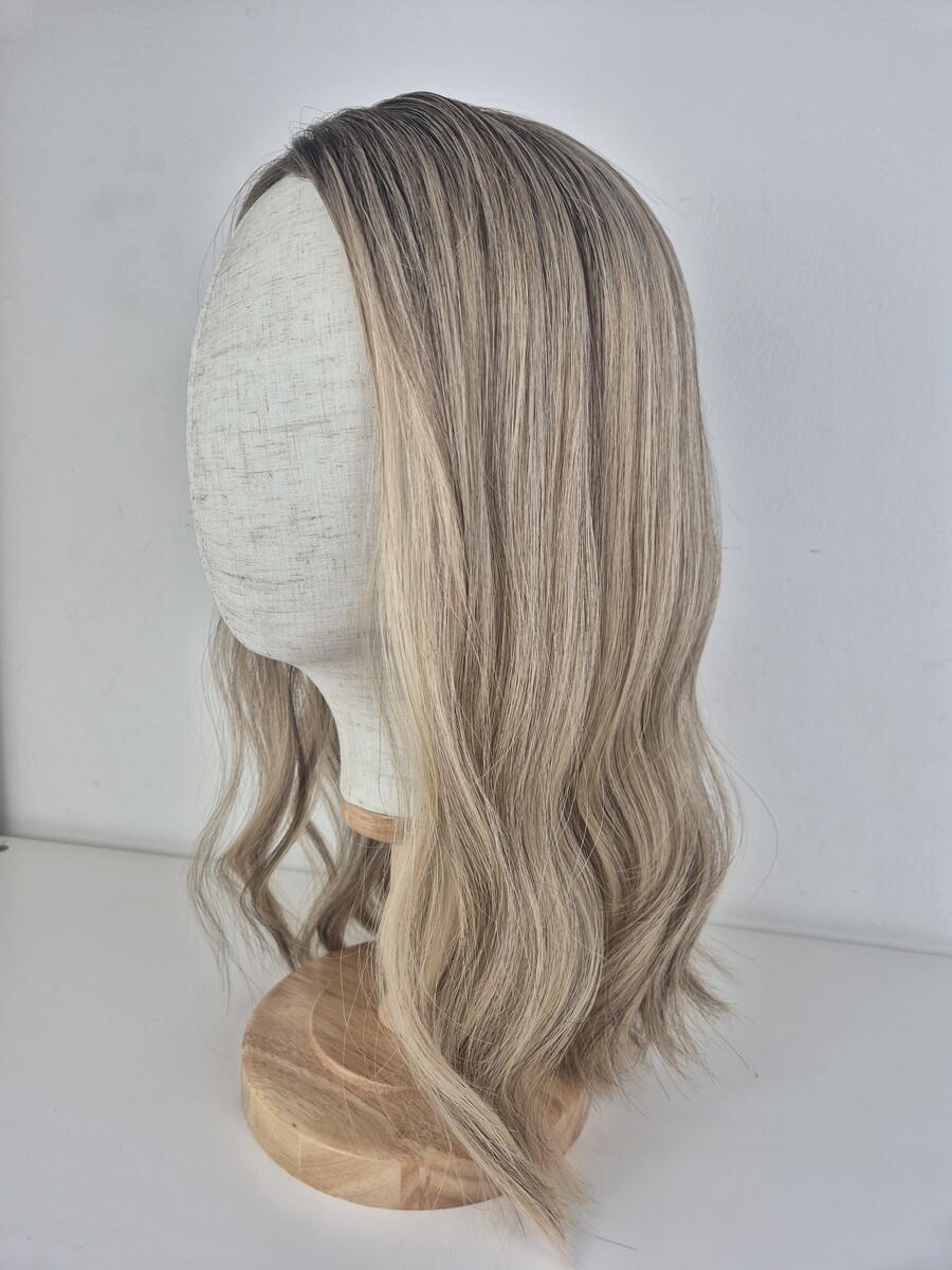 Bianca lace topper 18 inch length cool-toned beige blonde with soft ashy undertones. Displayed on a mannequin