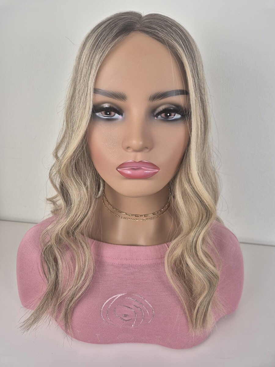 Bianca lace topper 18 inch length neutral blonde with level 7 lowlights and root displayed on a mannequin