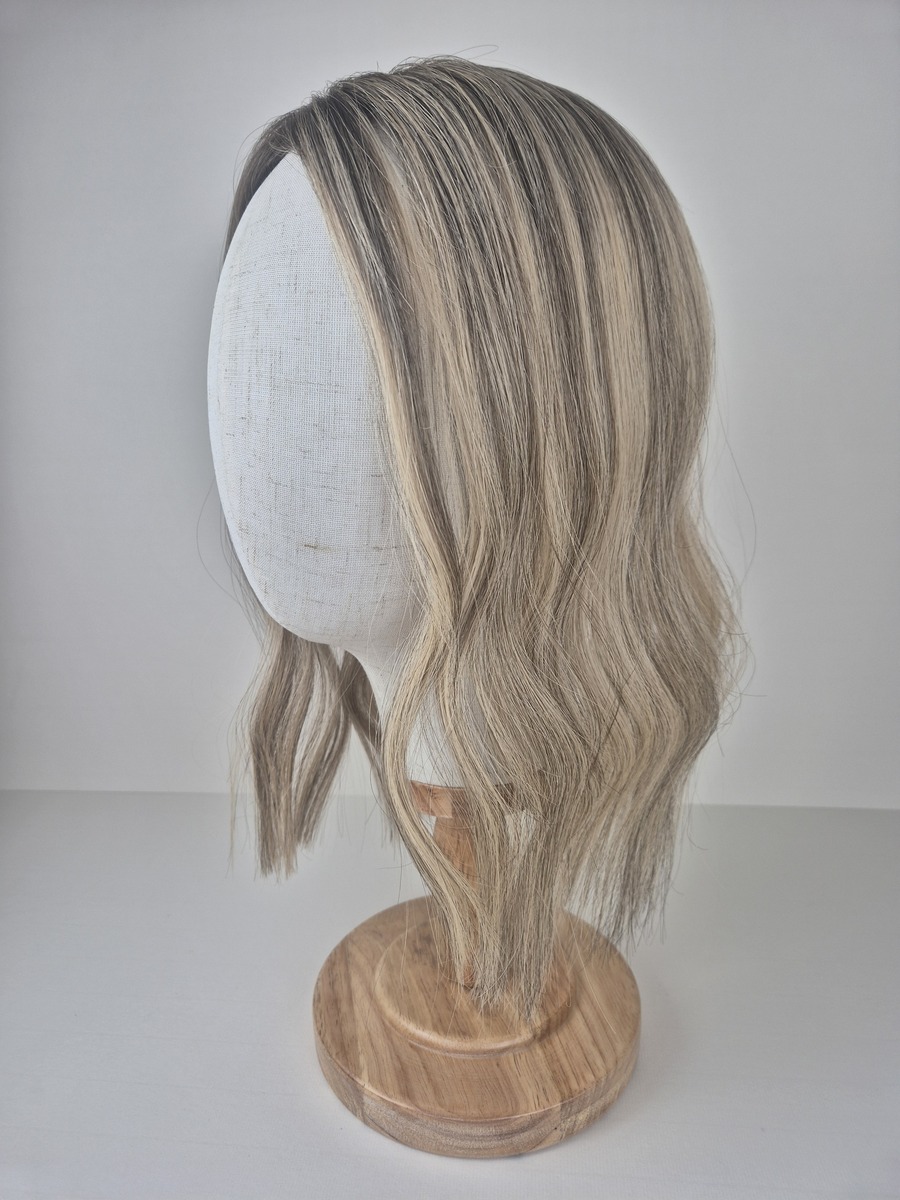 Bianca lace topper 14 inch length medium toned beige blonde with soft ashy undertones. Styled with a wave displayed on a mannequin