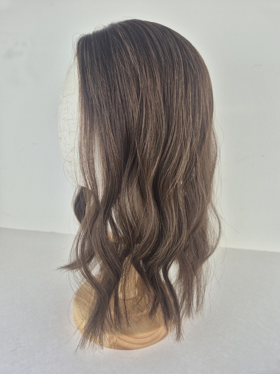 Rose lace topper 16 inch length cool light blonde styled with a wave displayed on a mannequin