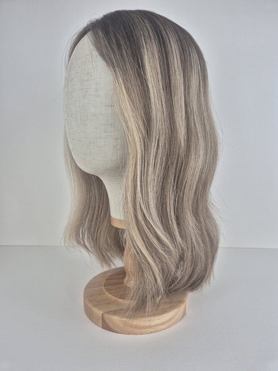 Ava Lace Topper 16 inches mushroom blonde with a dark blonde root and dimensions styled waved displayed on a mannequin