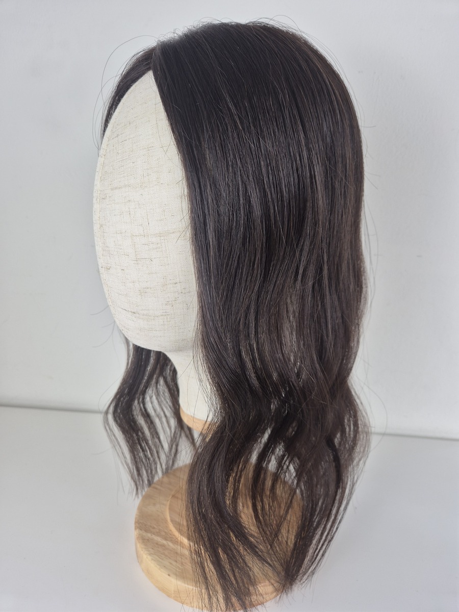 Tiny Topper Cara low density hair topper 16-inch length in espresso brown brunette. styled with wave. Displayed on a mannequin