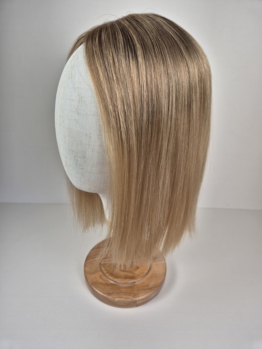 Chloe Ribbon Topper Dark blonde with soft beige and honey dimension16 inch length displayed on a mannequin styled straight