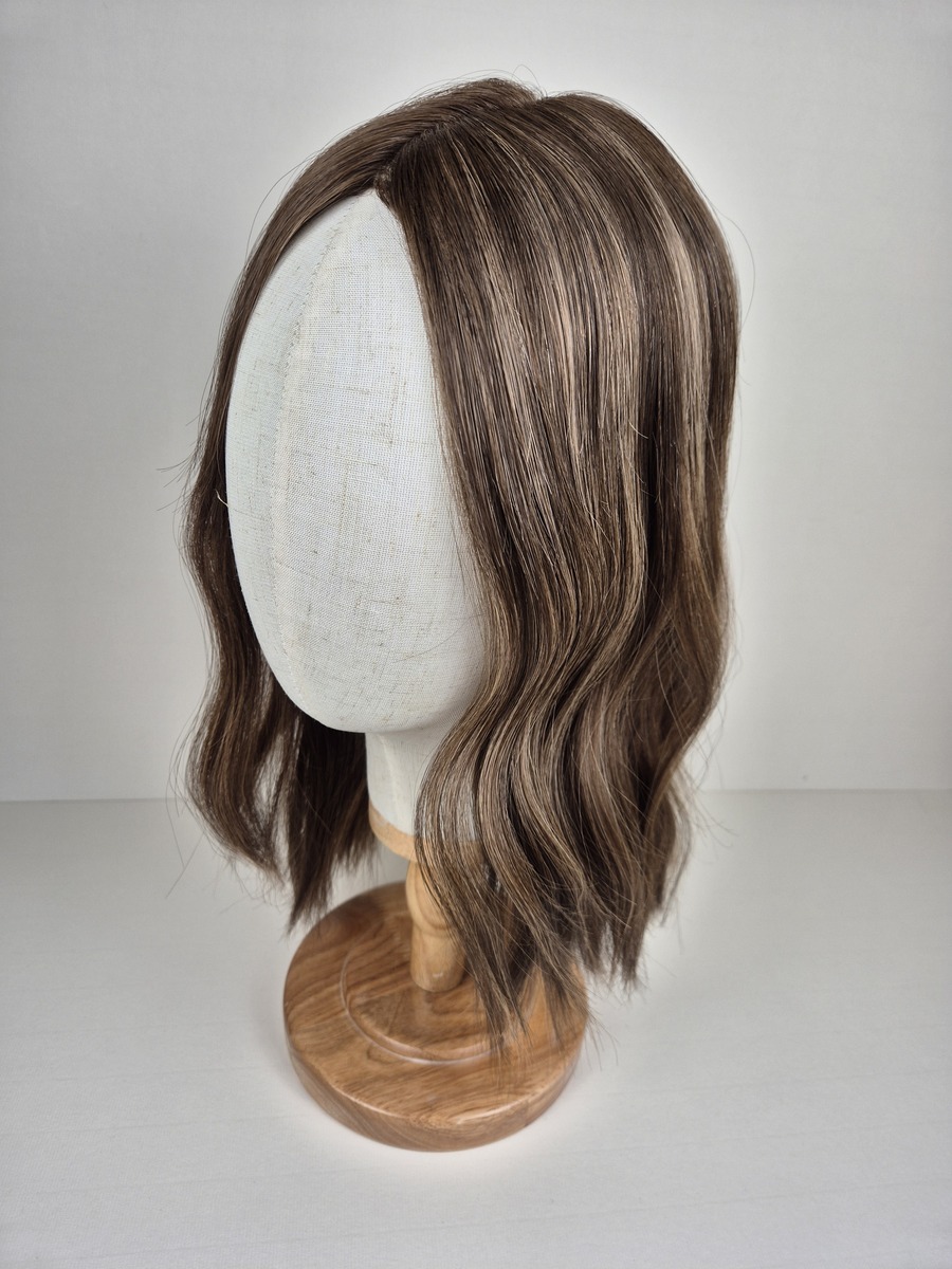 Maya Ribbon Topper Medium ash brown with cool beige and mocha dimension 16 inches 8x8 cap styled wavy displayed on a mannequin