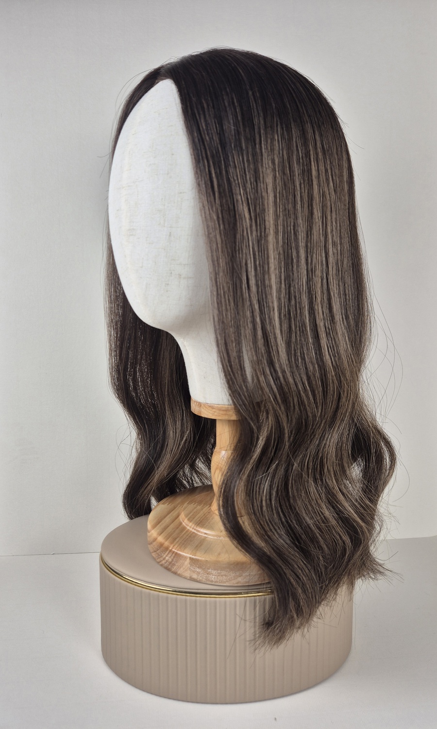 Mia lace topper 20 inches medium ash brown with highlights and a long root displayed on a mannequin