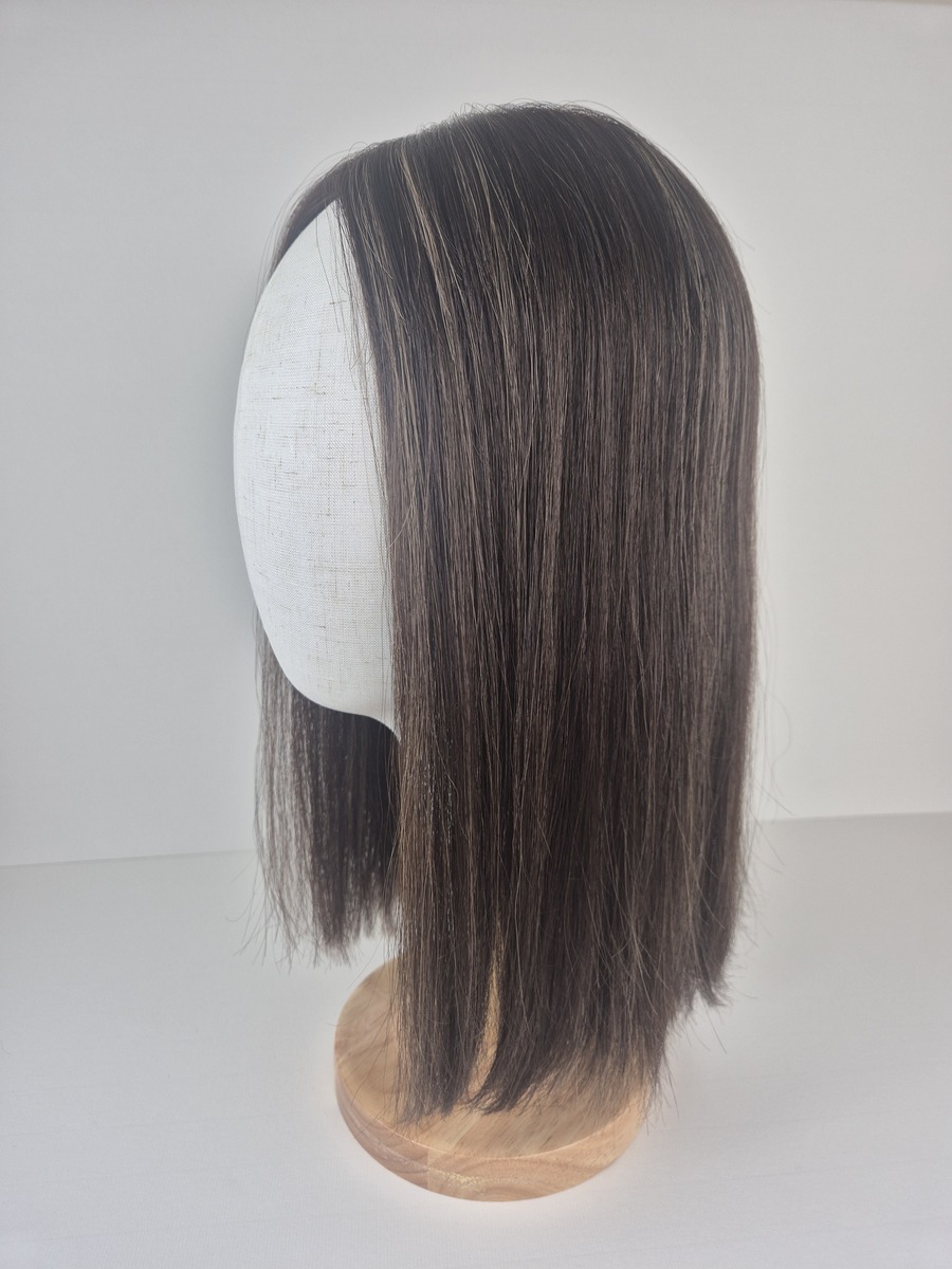 Nadine Ribbon Silk topper 16 inches in length chestnut brown with caramel highlights styled straight displayed on a Mannequin