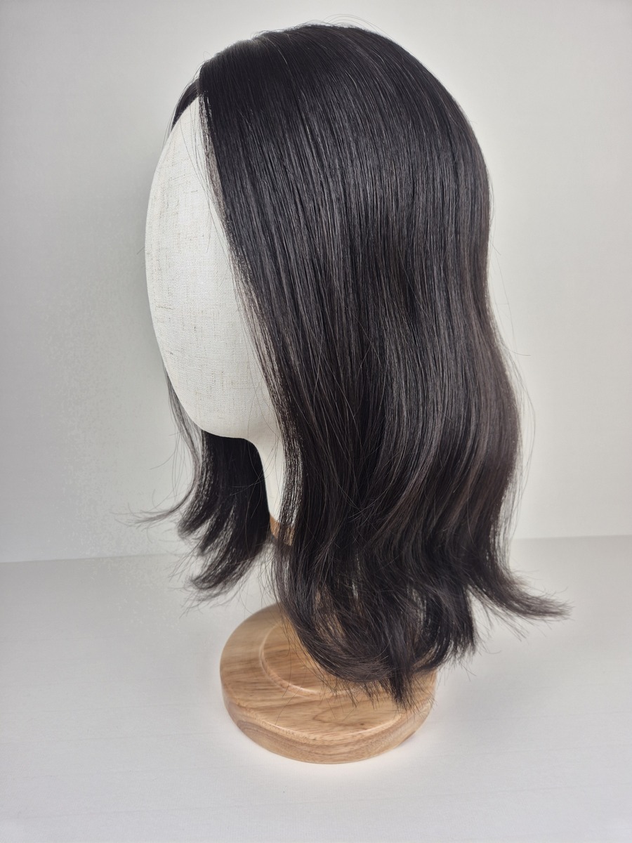Rhea Ribbon Silk topper 16 inches in length darkest brown styled wavy displayed on a Mannequin