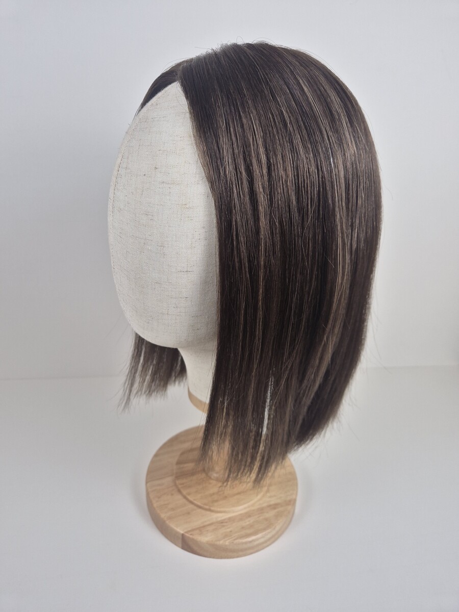Evelyn Ribbon Silk topper medium chocolate brown with subtle cool blonde highlights styled straight 14 inch length displayed on a mannequin.