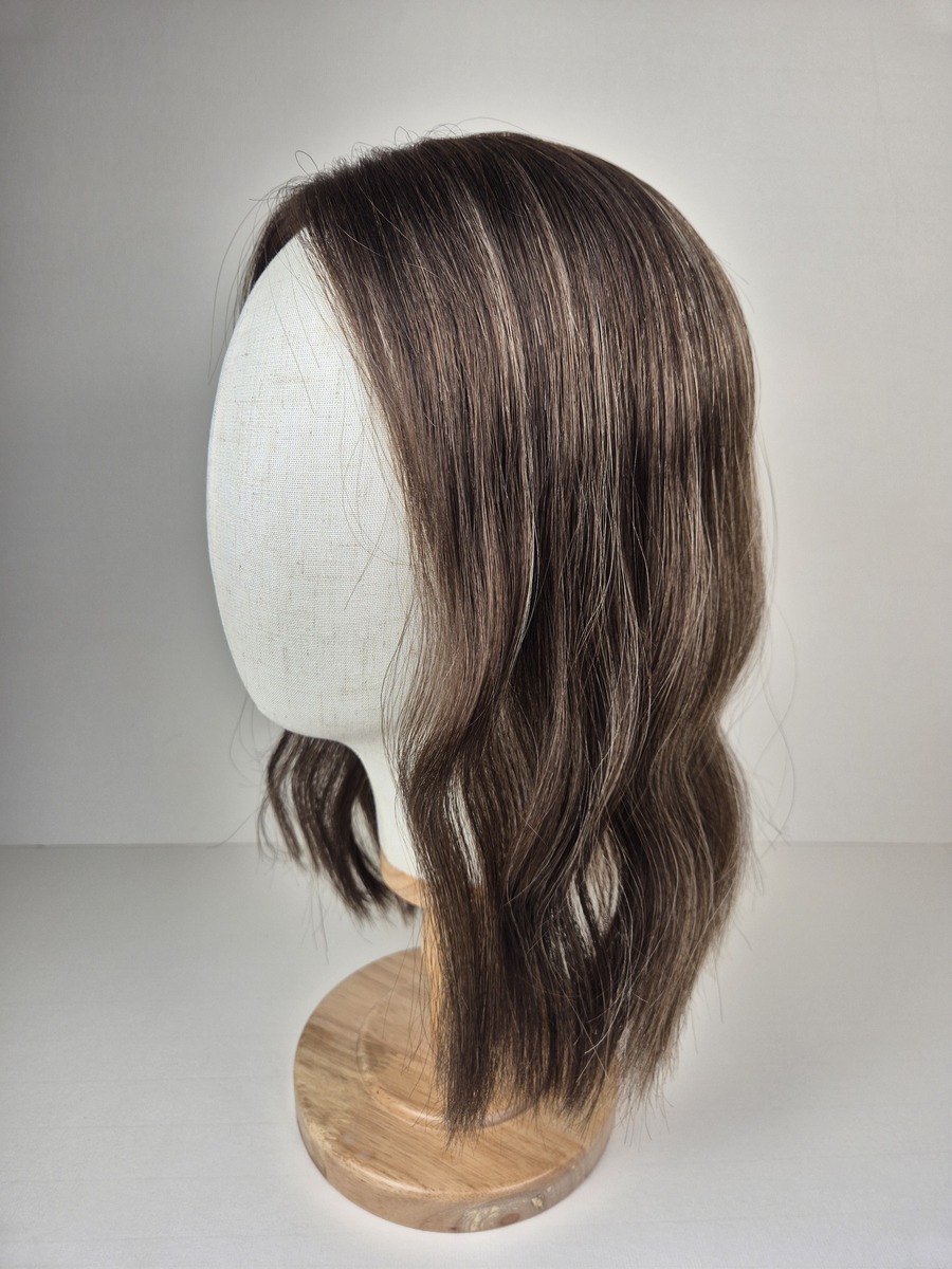 Carmel Little Lace topper 14 inches medium brown with cool blonde highlights styled wavy displayed on a mannequin