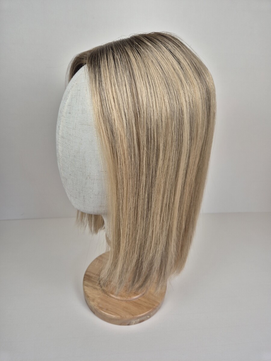 Kelly Ribbon Top 14 inch medium blonde with a root shadow and dimensions styled straight displayed on a mannequin
