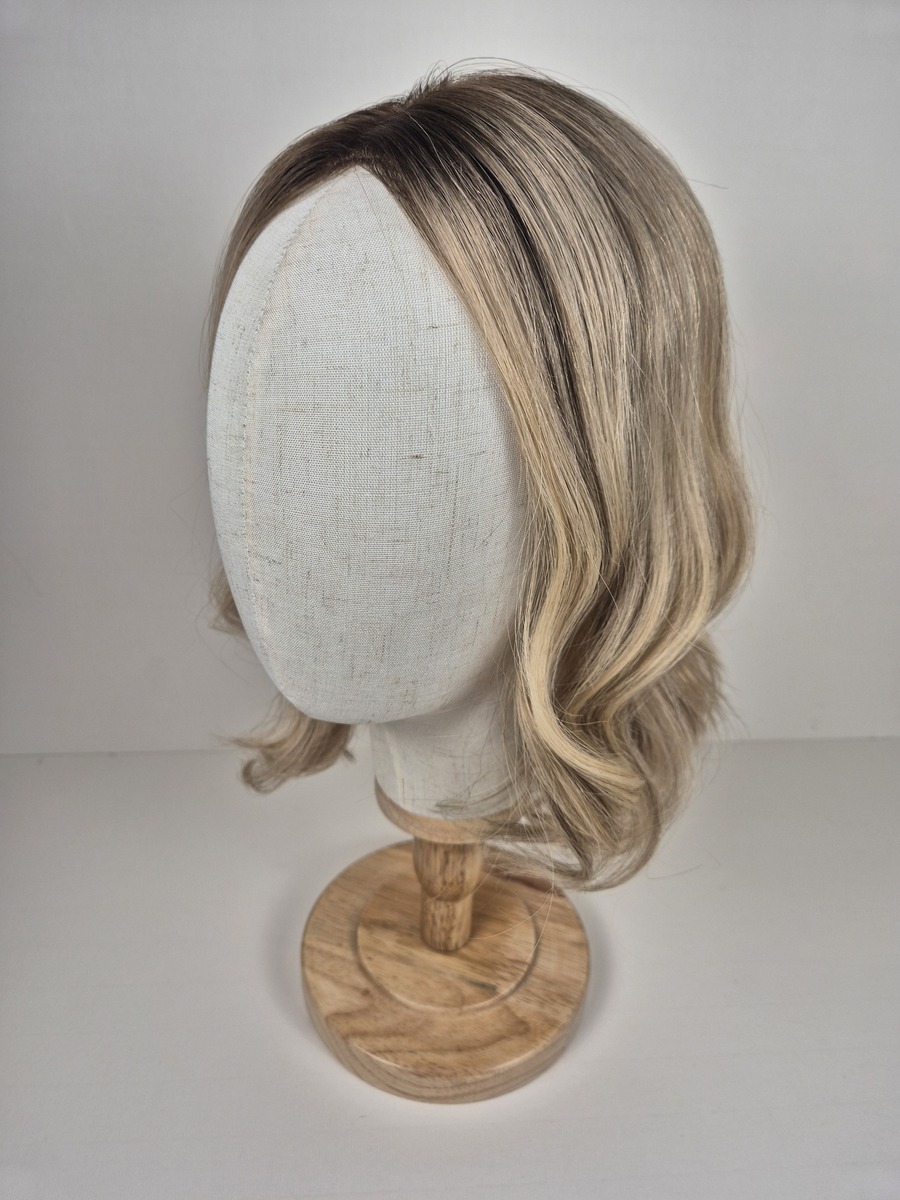 Kelly Ribbon Top 14 inch medium blonde with a root shadow and dimensions styled with a curl displayed on a mannequin